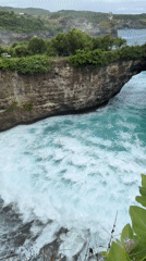 Tourists capture Nusa Penida's dramatic coastal rock formations
