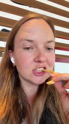 Person enjoys McDonald's meal in northern Italian town