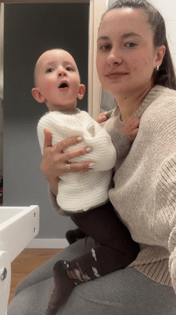 Woman holds toddler in casual moment, Odintsovo