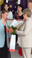 Graduation ceremony held with Cyrillic sashes and 2026 decorations