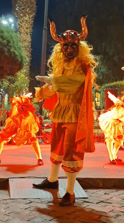 Traditional dancers perform nighttime cultural event in Arequipa plaza