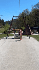Father and toddler enjoy playground time in Wisła, Poland