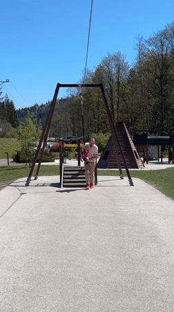 Father and toddler enjoy playground time in Wisła, Poland