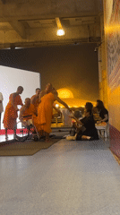 Candlelit Buddhist ceremony at Wat Phra Dhammakaya temple grounds