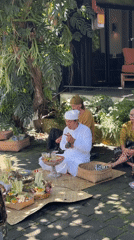 Balinese Hindu blessing ceremony conducted outdoors in Ubud District