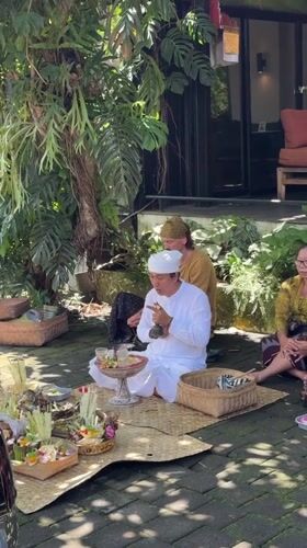 Balinese Hindu blessing ceremony conducted outdoors in Ubud District