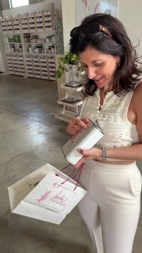 Woman browses traditional Sicilian goods store in Solarino