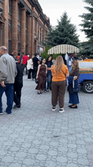 Street activity on cobblestone street in Gyumri, Armenia