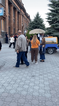 Street activity on cobblestone street in Gyumri, Armenia