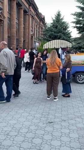 Street activity on cobblestone street in Gyumri, Armenia