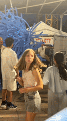 Giant blue balloon creature costume draws attention in Netanya plaza