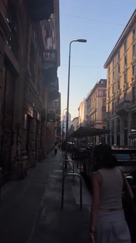 Evening scenes captured in Milan: street walker, restaurant dining
