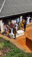 Funeral service held in Achara, Nigeria with white casket