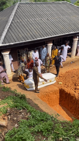 Funeral service held in Achara, Nigeria with white casket