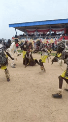 Traditional equestrian ceremony features costumed riders and dancers