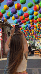 Tel Aviv market bustling with vendors, shoppers during afternoon