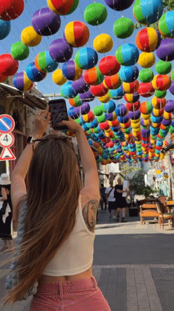 Tel Aviv market bustling with vendors, shoppers during afternoon