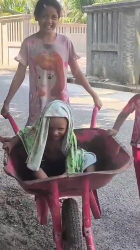 Casual outdoor play moments in a rural Indonesian village
