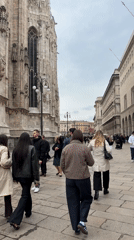 Routine tourist activity documented around Milan Cathedral Tuesday morning