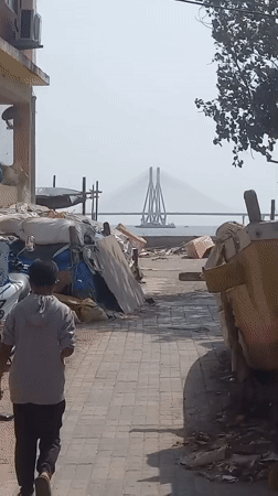 Person in grey hoodie spotted near Mumbai coastal bridge