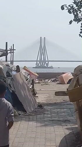 Person in grey hoodie spotted near Mumbai coastal bridge
