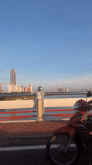 Clear skies over Đà Nẵng cityscape captured from bridge