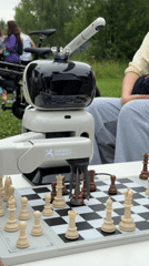 AGIMA outdoor event: fun run, robot chess, and foosball on grass