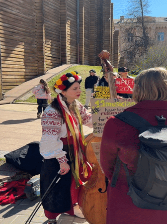 Pro-Ukraine demonstration with traditional music at Kyiv Golden Gate
