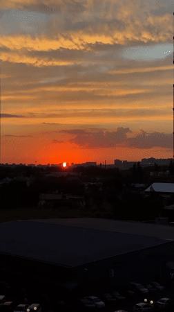 Krasnodar sunset watched from home, cats and screens included