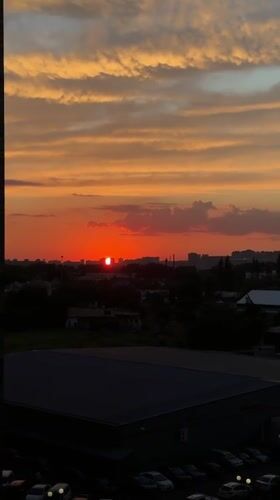 Krasnodar sunset watched from home, cats and screens included