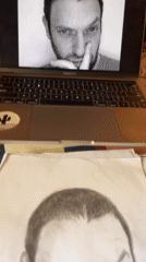 Artist creates detailed pencil portraits in Jos workspace