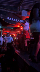 Evening entertainment and social gathering documented at Barazani tiki bar