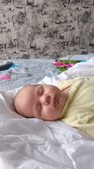 Baby sleeps peacefully in bedroom in Andreyevo, Russia