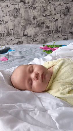 Baby sleeps peacefully in bedroom in Andreyevo, Russia