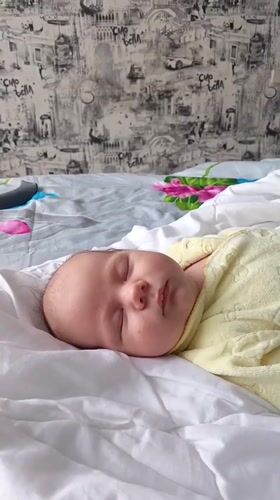 Baby sleeps peacefully in bedroom in Andreyevo, Russia