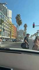 Tel Aviv beachfront promenade, active on a sunny afternoon