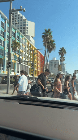 Tel Aviv beachfront promenade, active on a sunny afternoon