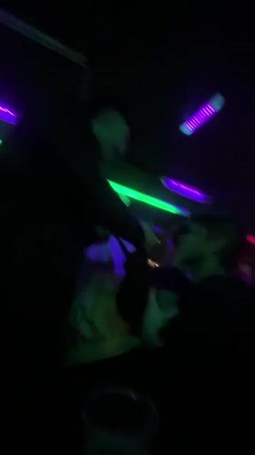 Nighttime footage captures silhouettes amid colorful lights in Buenos Aires