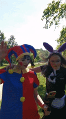 Costumed group films gathering in Prague park