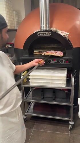 Behind the scenes at a Trento pizzeria on a busy evening