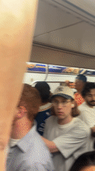 Early morning commuters fill NYC subway car