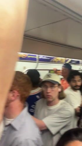 Early morning commuters fill NYC subway car