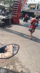 Motorcycle POV through Krian's streets on a busy morning