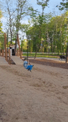 Woman enjoys morning at Birobidzhan park with ice cream, selfies