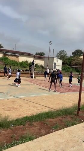 Young men play volleyball, basketball on outdoor courts in Nigeria
