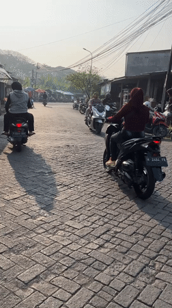 Morning street life along a busy East Java corridor