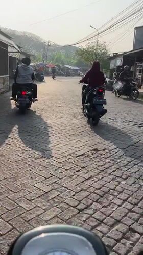 Morning street life along a busy East Java corridor