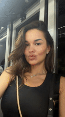 Woman films selfie video on public transport in Thailand