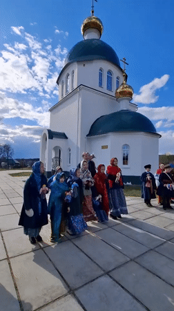 Children gather for traditional singing at Orthodox church in Markovo