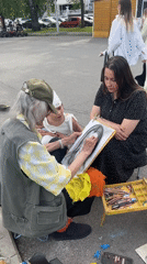Street artist draws portraits in public square, Ufa